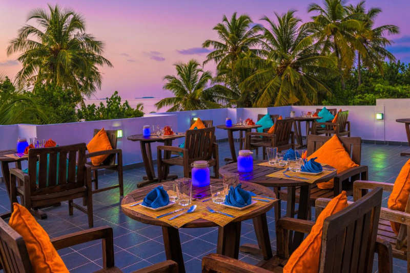 Boutique beach roof top restaurant at sunset