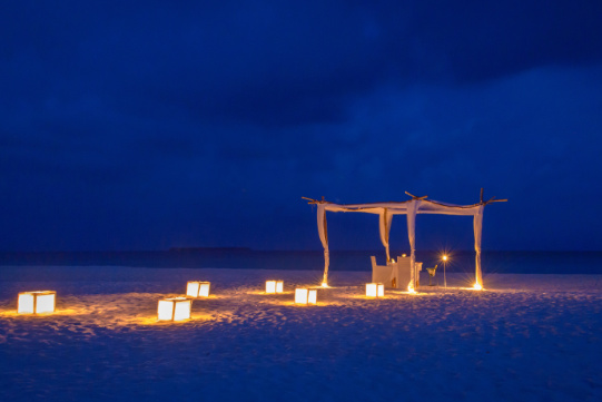 Romantic dinner at sunset in the Maldives