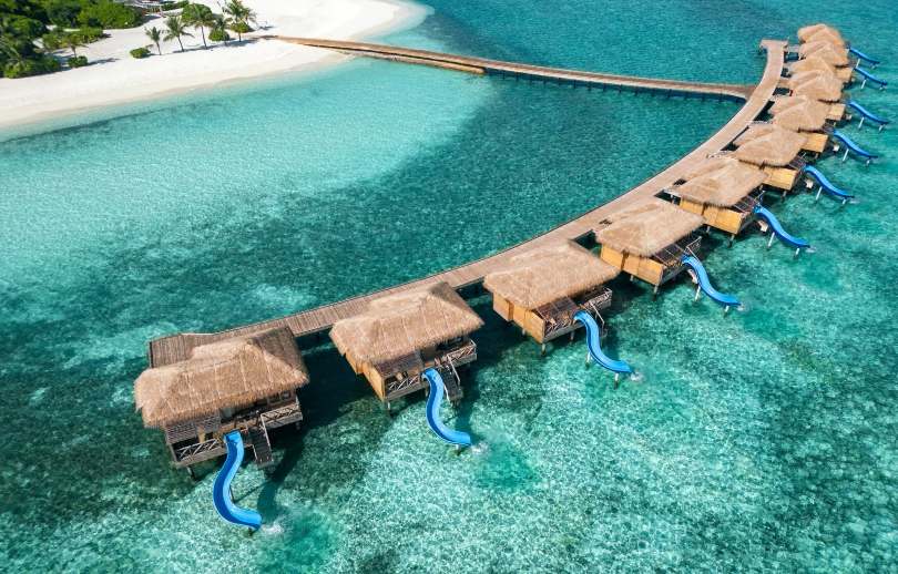 Aerial shot of villas with slides at You & Me Maldives