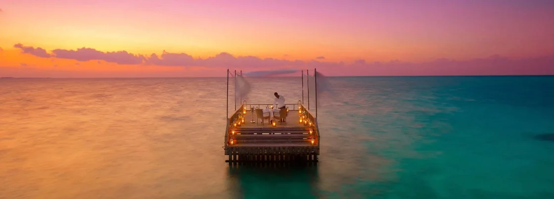 Overwater dining platform for romantic dinner in the Maldives