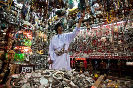 Local omani in Mutrah souk selling souvenirs